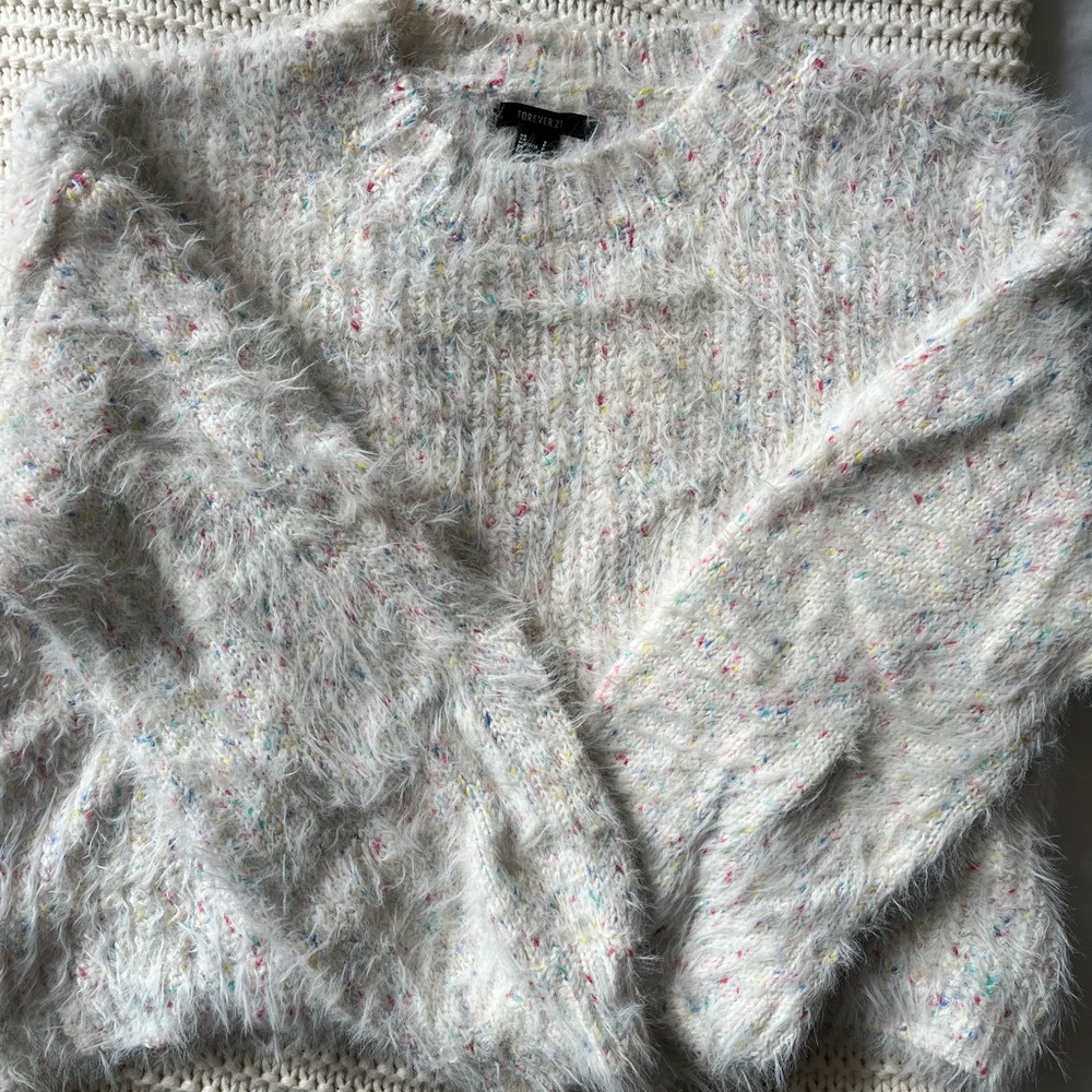 Fuzzy sweater with rainbow coloring